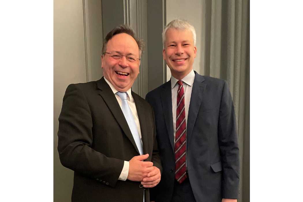 Steffen Bilger, on the right, standing beside a smiling man in a black suit